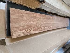 lot 83 image: 2 boxes oak gingered gluedown vinyl flooring
