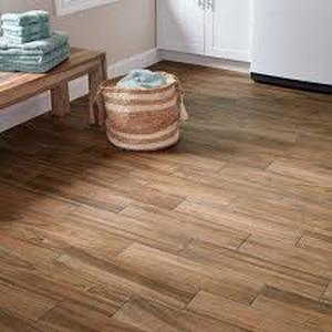 lot 10 image: 22 Boxes of Daltile Baker Wood 6 in. x 24 in. Walnut Glazed Porcelain Floor and Wall Tile (14.55 sq. ft.Case)  Customer Returns See Pictures