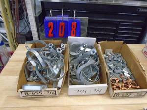 Box of pipe straps. As shown.