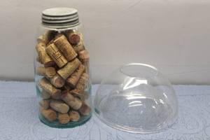 lot 1 image: Vintage Glass Jar Filled with Assorted Wine Corks with Glass Dome Lid