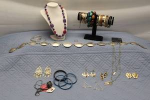 lot 123 image: Assorted Jewelry Lot including Necklaces, Earrings, and Bracelets