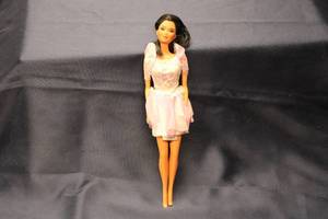 lot 131 image: 1966 Vintage Doll with Pink Dress and Holographic Details