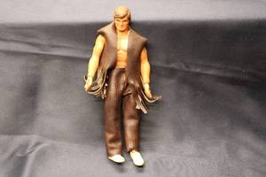 lot 132 image: Vintage Cowboy Action Figure with Fringe Outfit and Sneakers