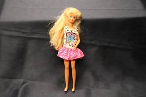 lot 148 image: Vintage Fashion Doll with Long Blonde Hair and Colorful Dress