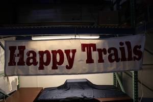 lot 180 image: Happy Trails Vinyl Banner with Grommets for Hanging