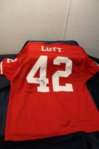 lot A-314 image: Ronnie Lott Autographed Football Jersey with Certificate of Authenticity, Bat and Storage Basket