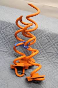 lot 322 image: Orange Spiral Ground Anchor Stake with Dual Pegs