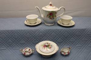 lot 352 image: Vintage Floral China Tea Set with Teapot, Cups, and Saucers