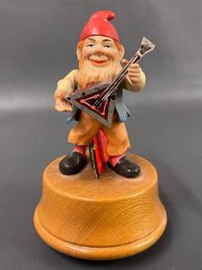 lot 152 image: Anri Musical Gnome Figurine With Guitar On Wooden Base