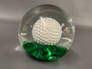 lot 157 image: Glass Paperweight with Golf Ball Design and Green Base, Unique Collectors Item