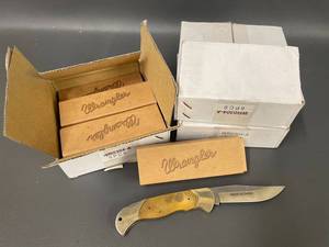 lot 334 image: Bulk Lot of Model 330 A Wrangler Folding Pocket Knives Brass Handle Stainless Steel Blade
