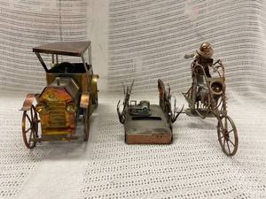 lot 212 image: Vintage Metal Art Antique Vehicle Sculptures  Music Box