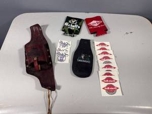 lot 43 image: Lot of Beer Koosies, Leather Beer Can Holder, and Stickers