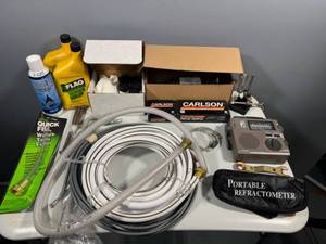 lot 108 image: Lot of Automotive Supplies and Accessories including Touch-Up Paint Kit, Transmission Fluid, and Water Filler