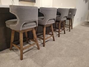 lot 58 image: A set of 4 contemporary Swivel Bar Stools by Four Hands Furniture.