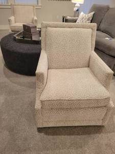 lot 68 image: A pair of Sam Moore Animal Print Swivel Armchairs.