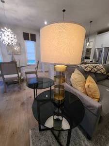 lot 6 image: A pair of Metal and Glass banded Table Lamps by Uttermost.