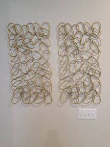 lot 33 image: A pair of Uttermost In the Loop 2-Pc Gold Finish Metal Wall Art.