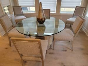 lot 11 image: Modern and Elegant Round Glass Top Dining Table with 6 Dining Chairs.