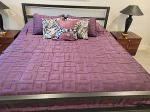 lot 71 image: King Size Bed. Metal Bed with all bedding and Mattress Shown.
