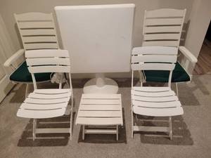 lot 85 image: Ketler Resin Patio Furniture. 4 Chairs, 1 Table and a footstool.