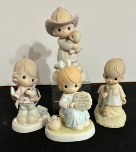 lot 33 image: Four Collectible Precious Moments Figurines including Precious Moments Figurine Lord Rescued Me and More