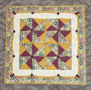 lot 103 image: Windmill Whimsy Hand Crafted Quilted Textile by Stella Marie