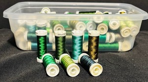 lot 150 image: Bin of Assorted Green Thread Spools
