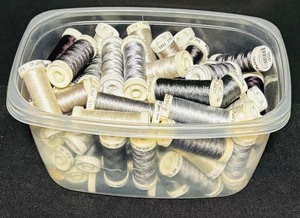 lot 152 image: Bin of Assorted Grey and White Thread Spools