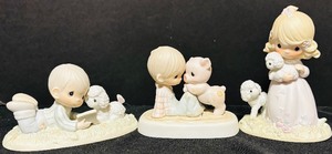lot 158 image: Three Precious Moments Collectables including I Love To Tell The Story and More