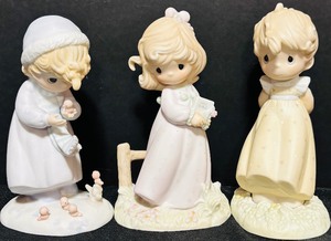 lot 222 image: Three Precious Moment Collectibles Including Winters Song and More