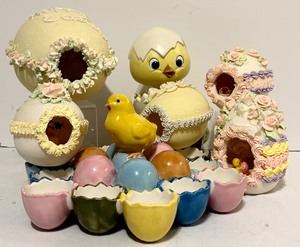 lot 360 image: Easter Chick in Cracked Egg Music Box, Porcelain Egg Holders and Five Different Size Sugar Eggs with Cutout with Scenes