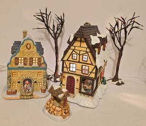 lot 501 image: Pair of Lighted Hummel Christmas Village Buildings and More