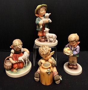 lot 511 image: Vintage Hummel Figurines including Honey Lover, Favorite Pet, Gift From A Friend and Lost Sheep