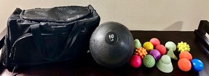 lot 84 image: Gym Bag with 10 Pound Rubber Slam Ball and Lacrosse Ball and Other Posture and Pressure Point Tools