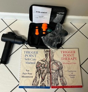 lot 86 image: Toloco Massage Gun and Self Care Trigger Point Books