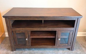 lot 21 image: Ashley Furniture Harpan Wood Entertainment Cabinet