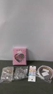 lot 187 image: Set of Hair Accessories Including Rubber Bands, Clips, and Headbands