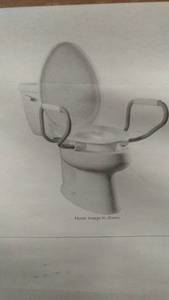 lot 38 image: Bemis Assurance Elongated Plastic Closed Front Toilet Seat with Support Arms in White