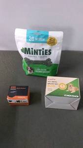 lot 124 image: Pet Supplies Lot Minties Dental Treats, Bark Control Device, and Pet Bath Brush Set