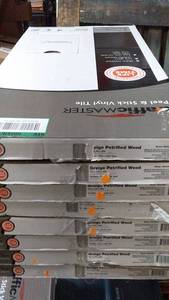 lot 151 image: Box of 8 TrafficMASTER Peel & Stick Vinyl Tiles - Greige Petrified Wood
