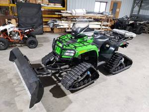 lot 6 image: Artic Cat 1000 EFI ATV - Green with tracks  snowplow and salter  spreader - used