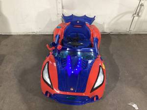 lot 590 image: Spider-Man Super Car 6 Volt with Lights and Sounds, by Dynacraft