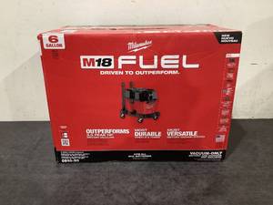 lot 709 image: Milwaukee M18 FUEL 6 Gal. Cordless WetDry Shop Vacuum with Filter, Hose, and Accessories