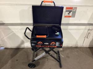 lot 321 image: Blackstone Adventure Ready 2-Burner 22 Propane Omnivore Griddle with Flex-fold Legs