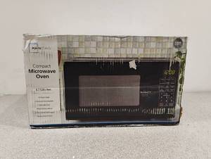 lot 55 image: NEW MAINSTAYS COMPACT MICROWAVE OVEN