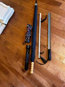 lot 137 image: Umbrellas, Flashlight & Sword Set