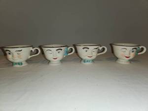 lot 67 image: Baileys Winking Face Teacup Set