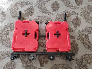 lot 11 image: Roto Pax Gas cans with mounting rack