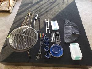 lot 16 image: Camp set with Fire pit marshmallow roasting forks 4 cups 4 bowls 4 dishes silver ware fire pit cover and misc pieces